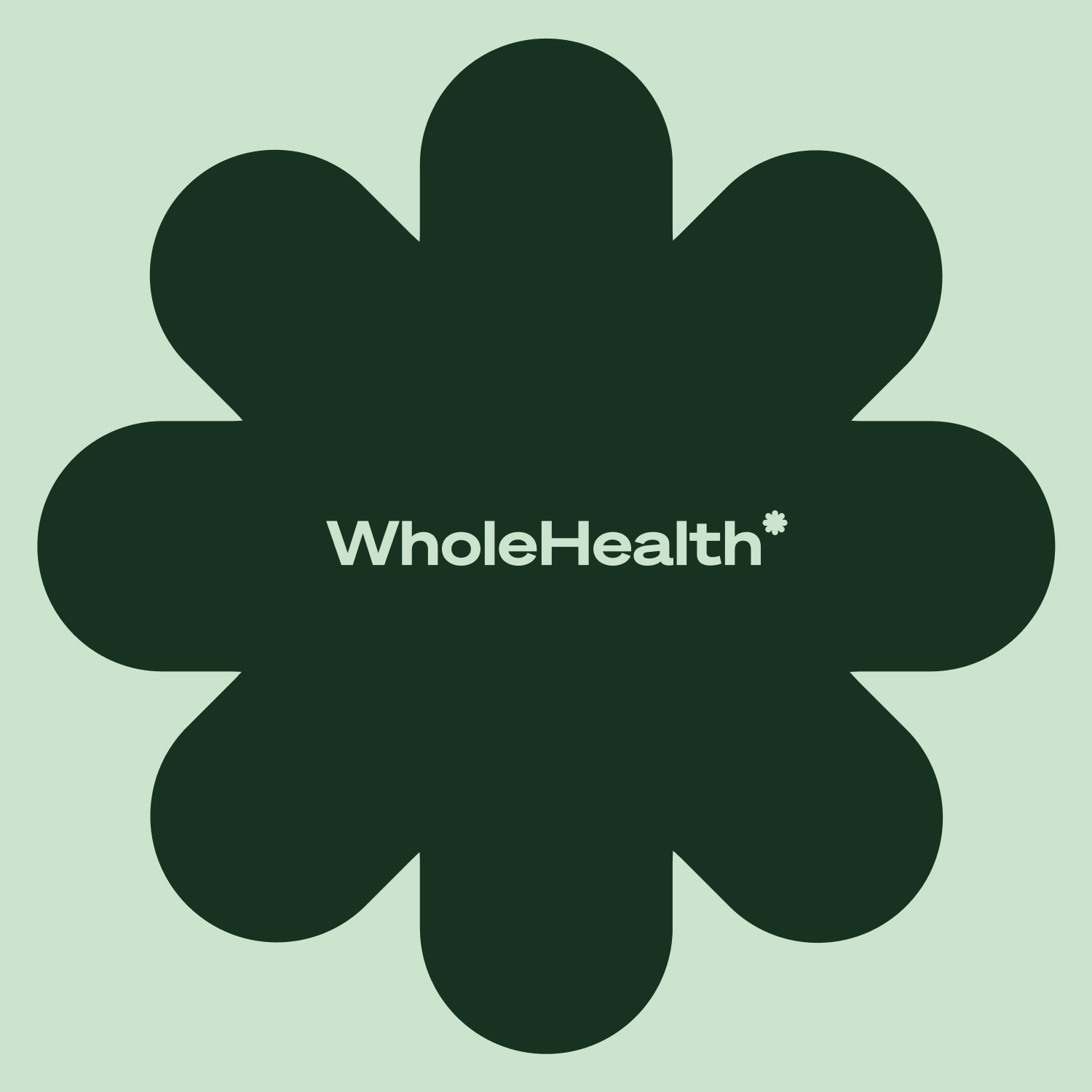 Whole Health green floral symbol and wordmark