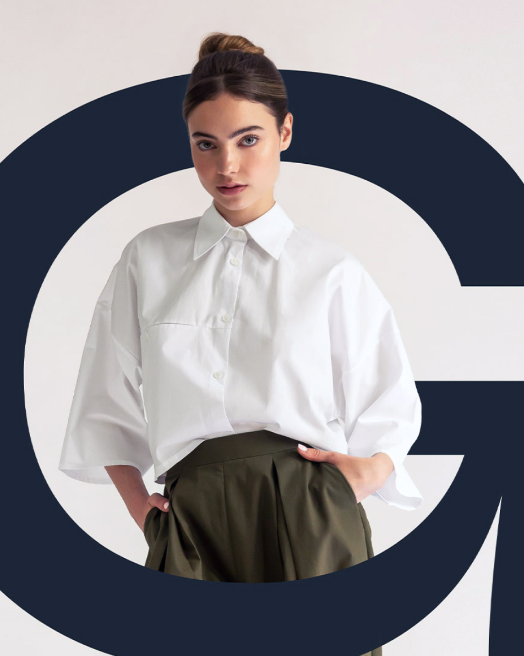 G.I.A.N. fashion identity with a model framed by the oversized G